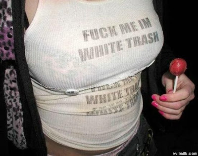 No doubt she's White Trash - ragged white wife beater with a black bra.