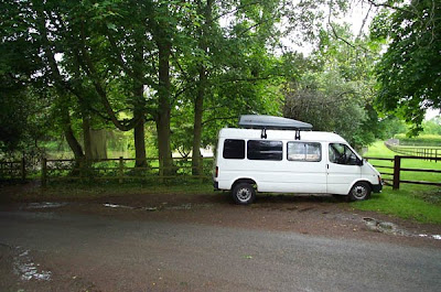 Our converted camper van overlooking the lake at Marston St Lawrence