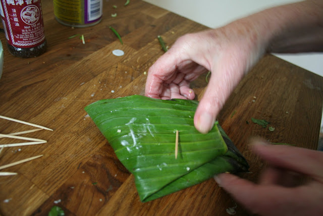 wrapping fish in A banana leaf