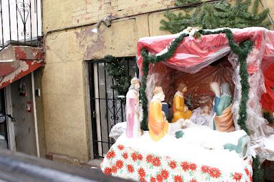 A snowy creche on the streets of New York