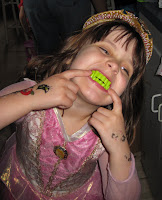 Young girl dressed like princess with green teeth!