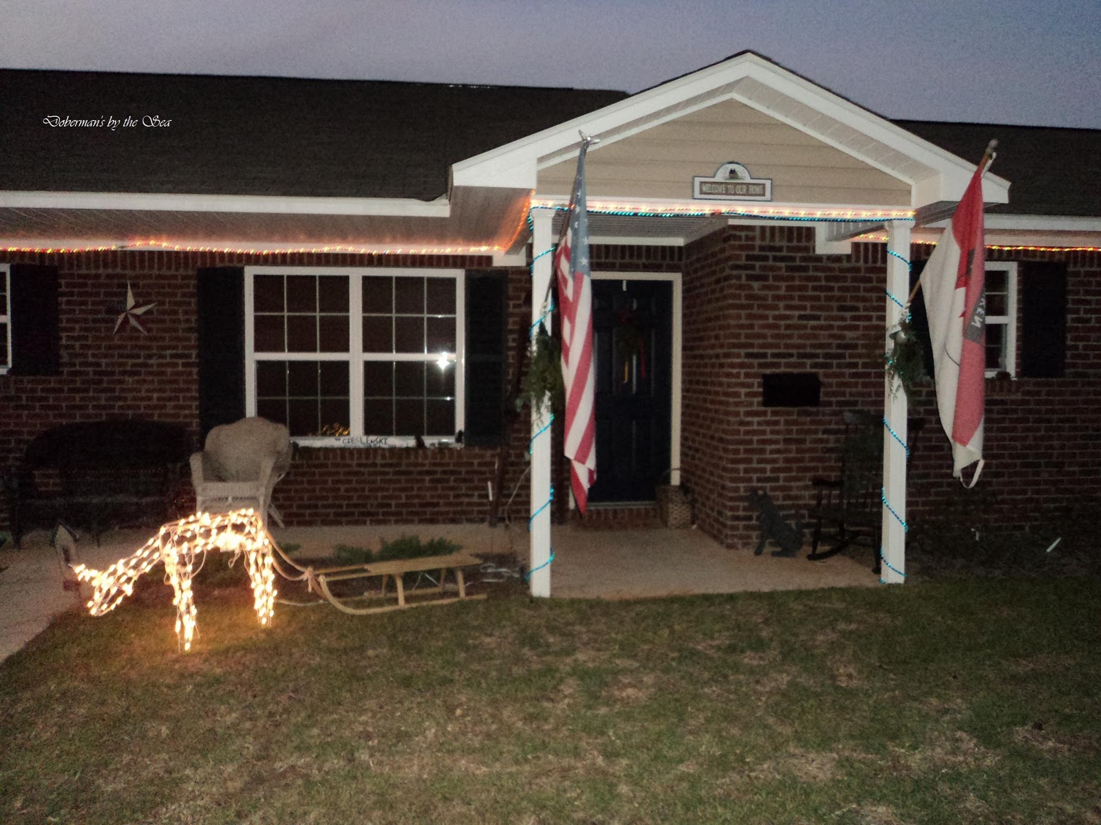 My house Christmas decor revealexterior Doberman's by the Sea