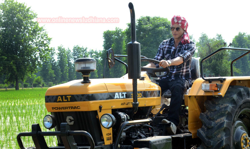Shah Rukh Khan drives a tractor during shooting at Village Jhande in Ludhiana