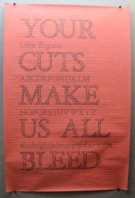 Sign reading Your cuts make us all bleed