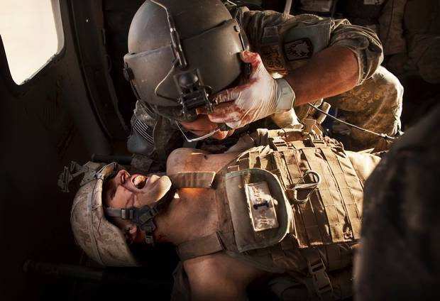 An injured Marine receiving care