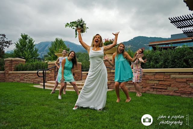 Boulder Colorado Wedding Photographer photography of the bride and he bridesmaid's having a little fun at the wedding in boulder colorado