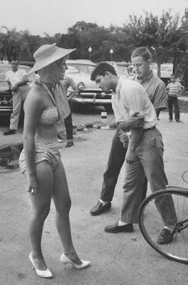 BULLET HOLES IN THE MAILBOX: FULLY CLOTHED WOMEN, A RETROSPECTIVE