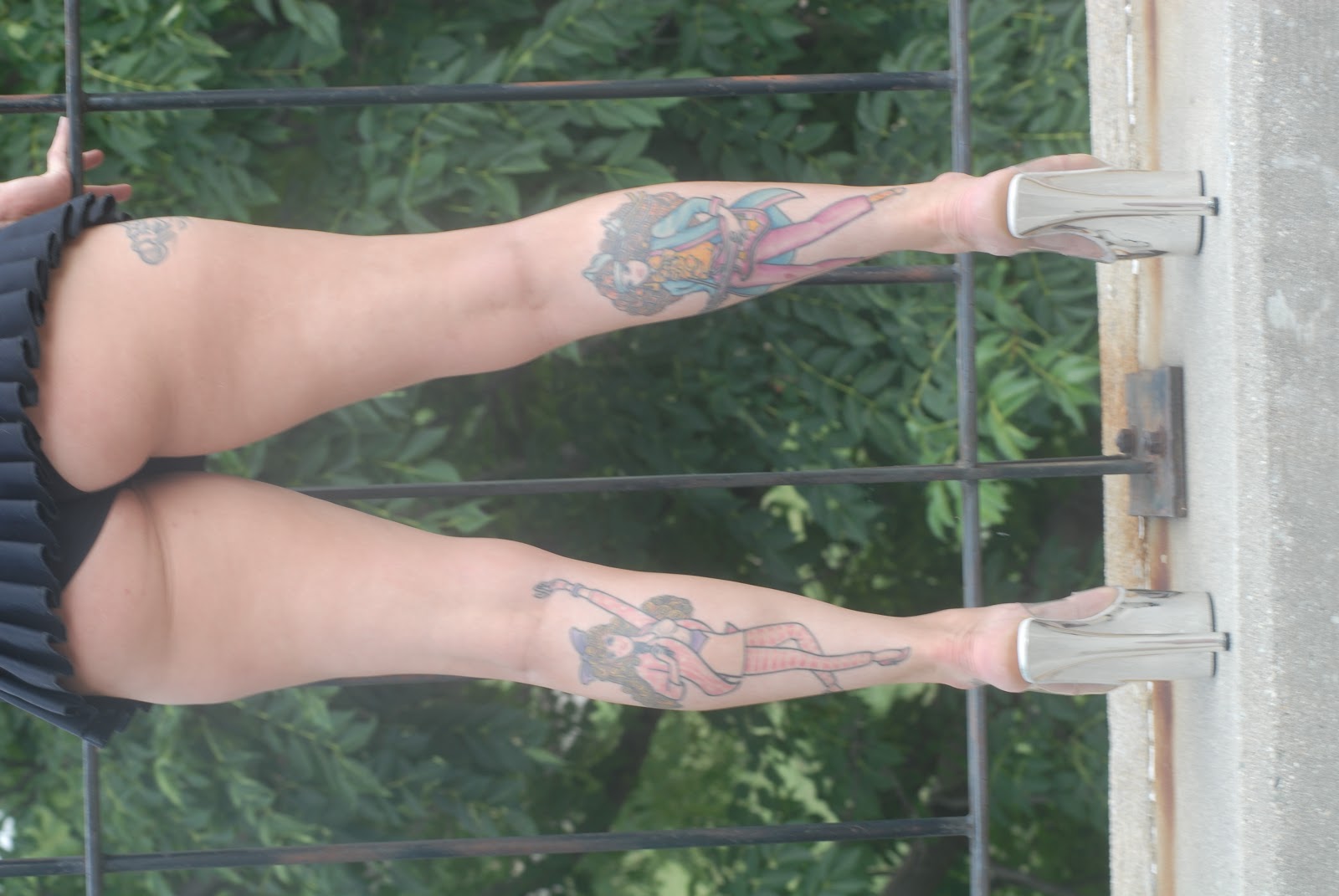The Girl With Leg tattoos 16