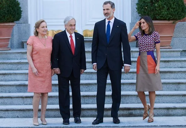 Queen Letizia wore Hugo Boss Seplea colorblock leather skirt, Boss Felisabeth Short sleeved sweater. President Sebastian Pinera and Cecilia Morel