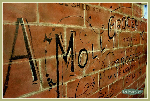 VIntage Advertising ghost wall painted on old cinder block basement wall, diy art studio, before and after makeover brick