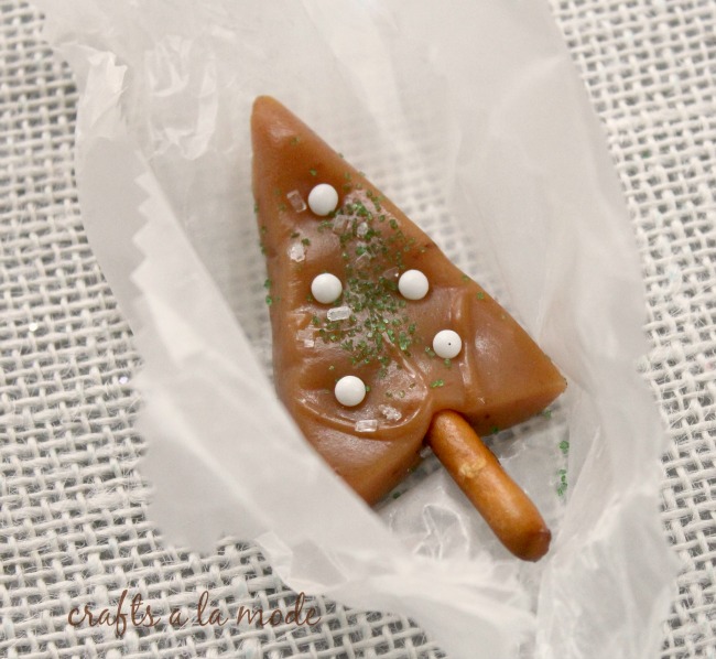 Caramel candy in the shape of a Christmas tree with a pretzel trunk