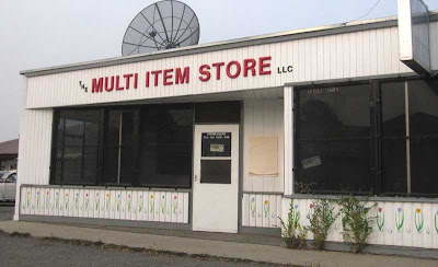 Vacant store front with plastic sign reading The Multiple Item Store LLC