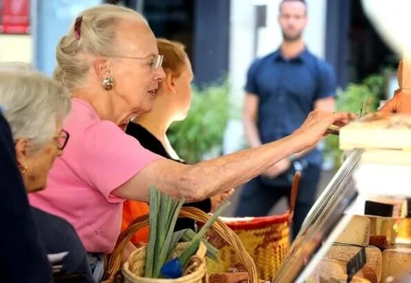 Danish Queen Margrethe visited an open-air market which is in the square outside Cahors cathedral