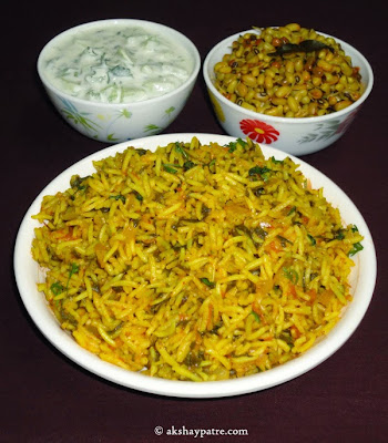 palak pulao with raita and usli in serving plate.