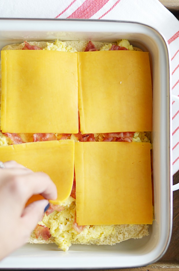 Scrambled eggs, bacon, and cheddar cheese sandwiched inside a sweet, buttery Hawaiian roll. The only thing better than how these taste is how easy they are to make for a crowd! 