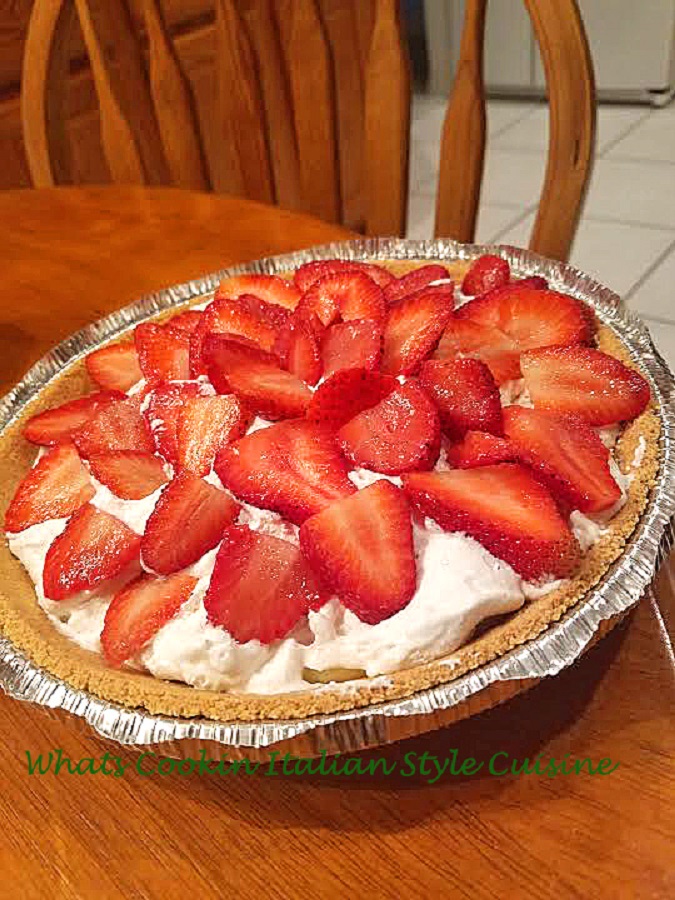 this is a no bake cheesecake with strawberries on top and graham cracker crust