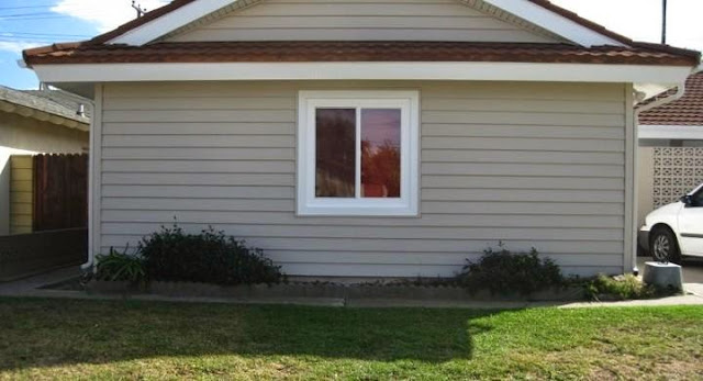 replacing vinyl siding with wood cost