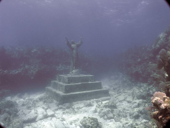 Christ of the Abyss is a submerged bronze statue of Jesus, of which the original is located in the Mediterranean Sea off San Fruttuoso between Camogli and Portofino on the Italian Riviera. It was placed in the water on 22 August 1954 at approximately 17 metres depth, and stands c. 2.5 metres tall. Various other casts of the statue are located in other places worldwide, both underwater and in churches and museums. The sculpture was created by Guido Galletti after an idea of Italian diver Duilio Marcante. The statue was placed near the spot where Dario Gonzatti, the first Italian to use SCUBA gear, died in 1947. It depicts Christ offering a blessing of peace, with his head and hands raised skyward.