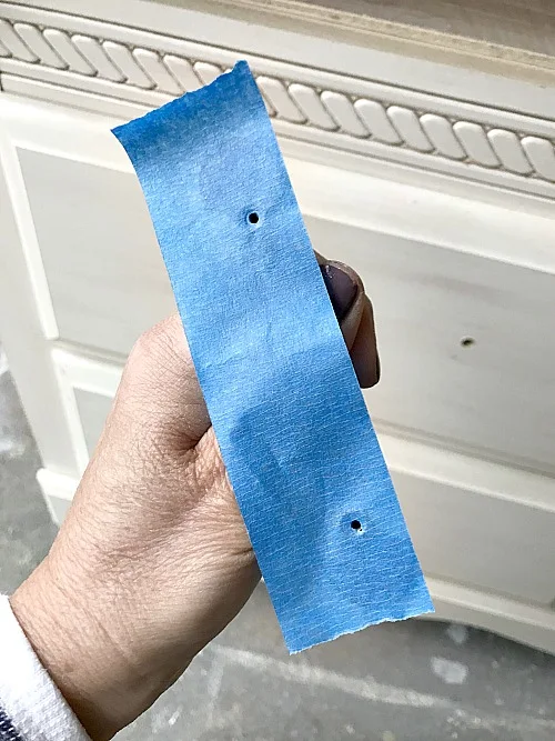 tape tip to find the hardware holes