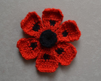 "Oriental Poppy" by Lesley Stanfield after blocking.  The petals have been opened and the centre has been adjusted to a concave shape. The intentional curl at the outside edges of the petals has been retained.