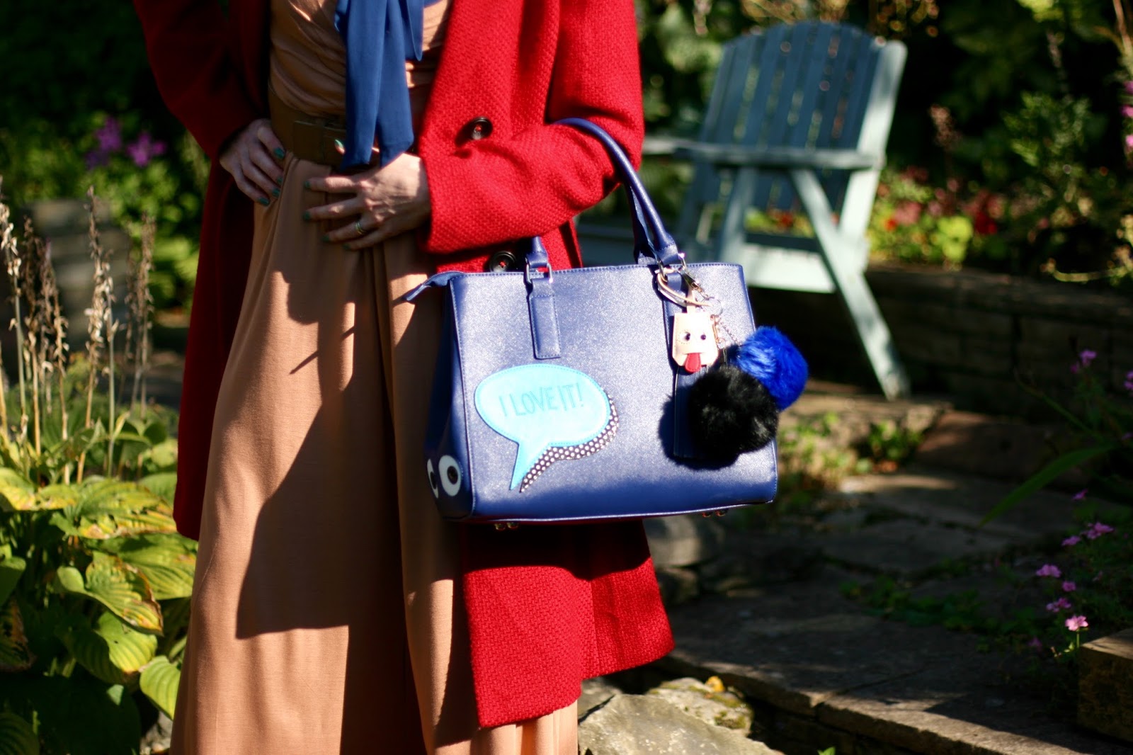 Marini Galanti bag with furry pom poms.