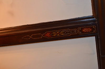 Decorative painting on ceiling beam from renovation in late 1920's Photo by Trisha Field