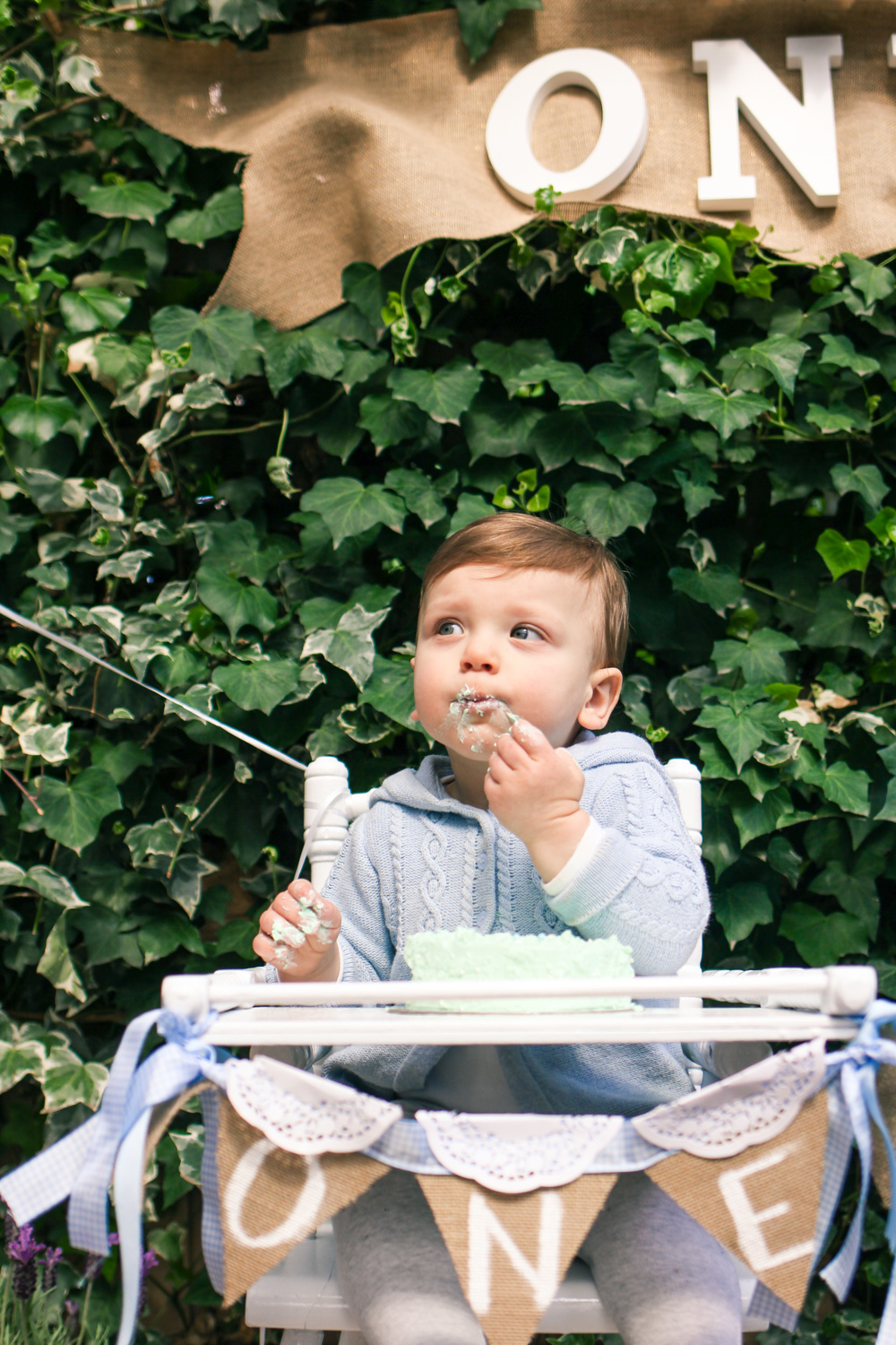 Baby cake smash with vintage high chair at Peter Rabbit themed first birthday