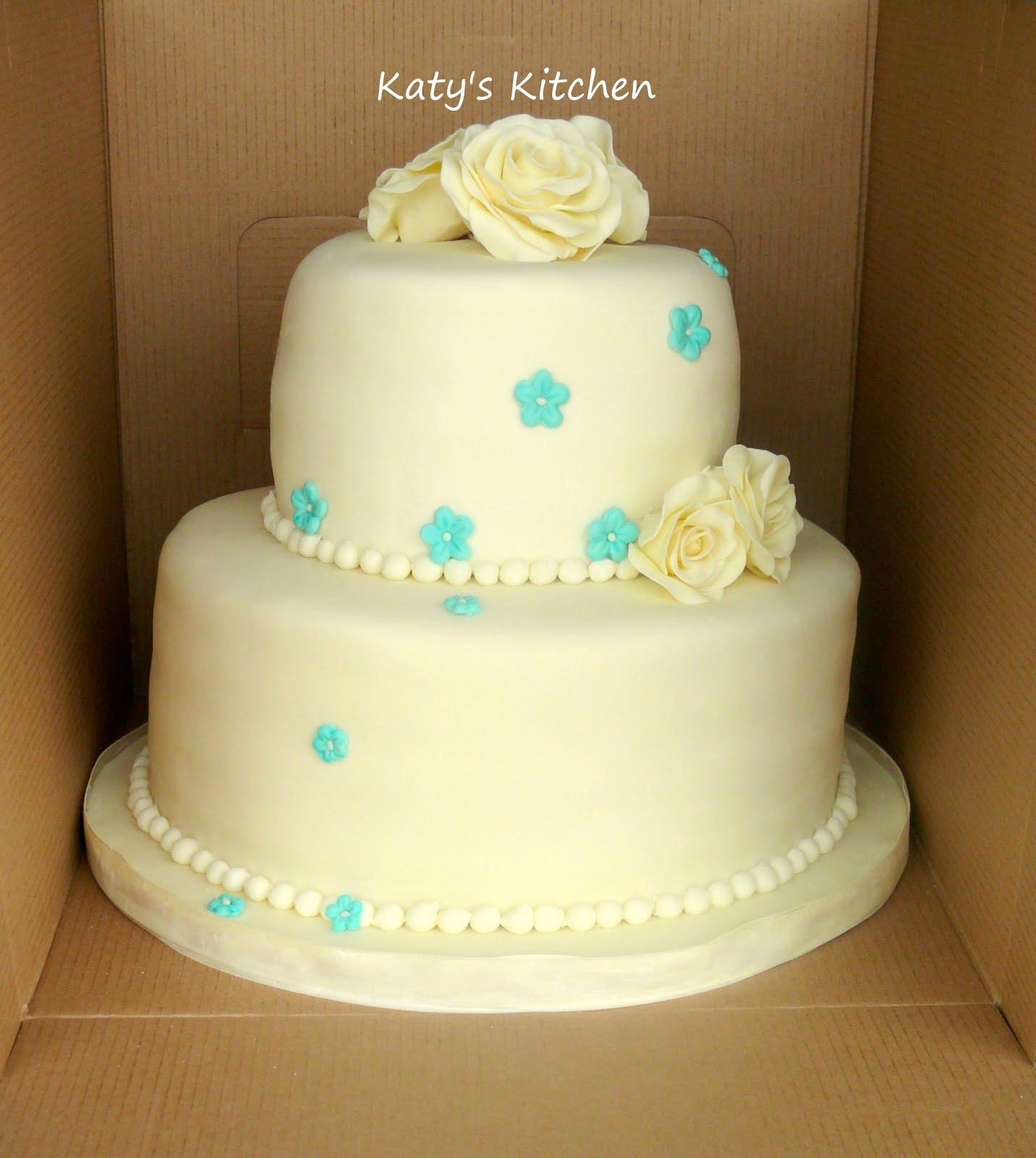 Katy's Kitchen Ivory and Turquoise Wedding Cake