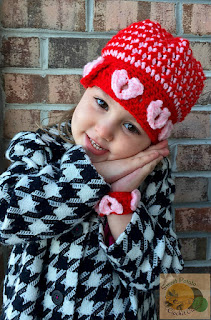 http://www.ravelry.com/patterns/library/pop-goes-my-heart-beanie