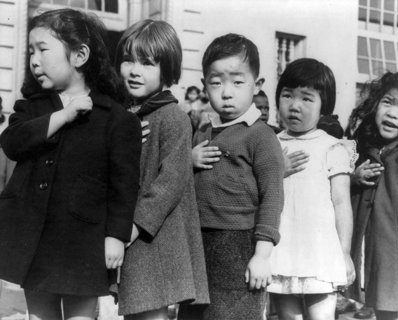 First graders at a public school in San Francisco pledge allegiance to the flag before evacuations are ordered.