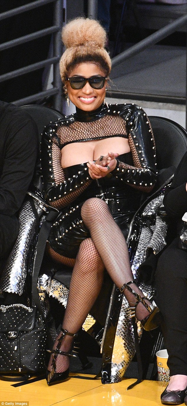 Nicki Minaj flashes cleavage in sexy black leather ensemble at Los Angeles Lakers game Nicki Minaj flashes cleavage in sexy black leather ensemble at Los Angeles Lakers game