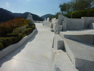 White marble path at "The Heights of Eternal Hope for the Future" hill at Kosanji Temple, mountains and sky in the background, At Kosanji Temple