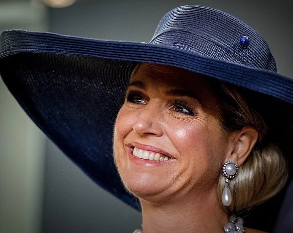 Queen Maxima wore Natan Lace Dress, Natan Pumps, Natan pearl necklace, Pearl Earrings, Velentino Sunglass