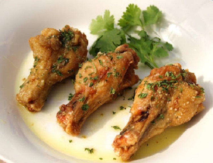 These are baked Italian wings with a garlic parmesan buttery coating after baked on top garnished with parsley. They taste like fried wings but they are baked not fried.