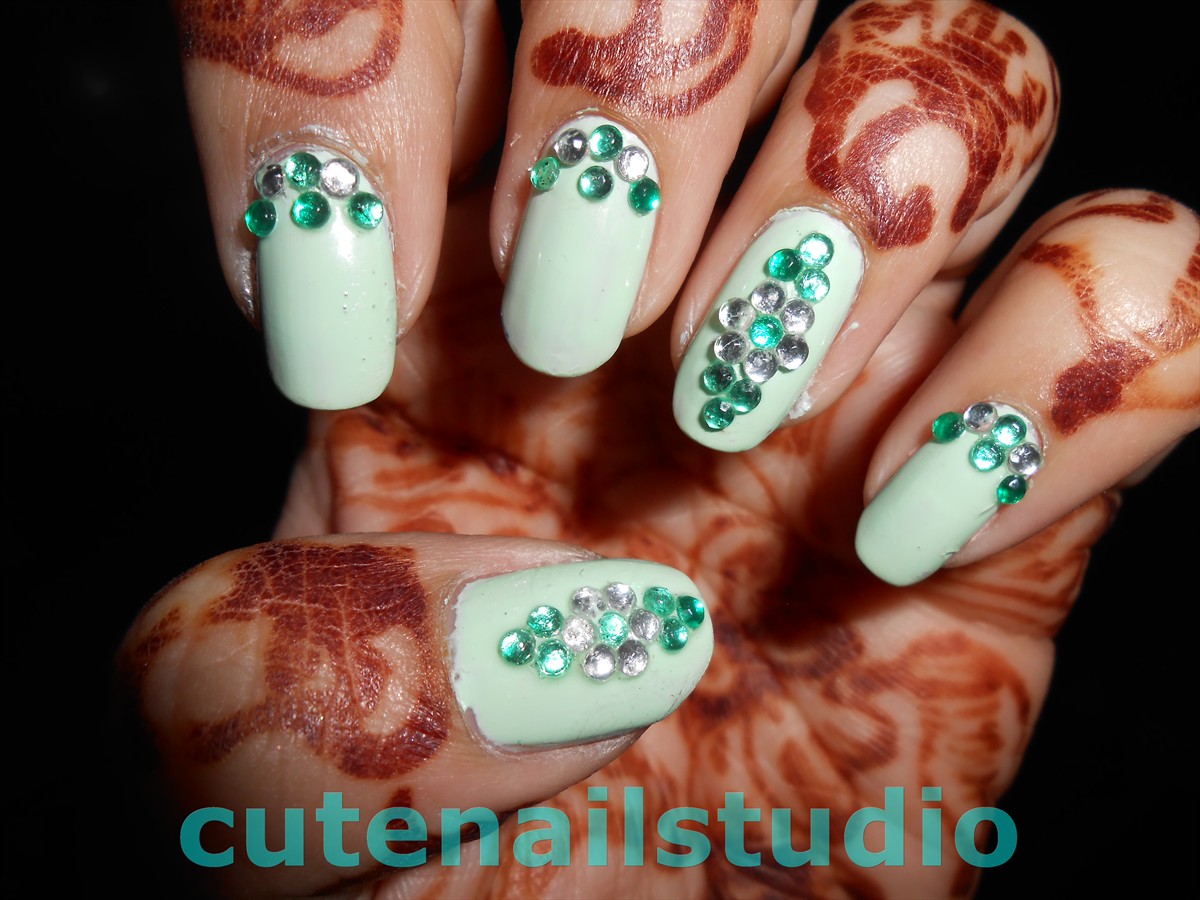 Cute nails Rhinestones and Mint color nail art.