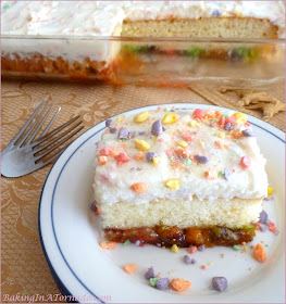 Sweet and Tart Cake, a French Vanilla cake with a gooey sweet and tart surprise. | Recipe developed by www.BakingInATornado.com | #recipe #cake