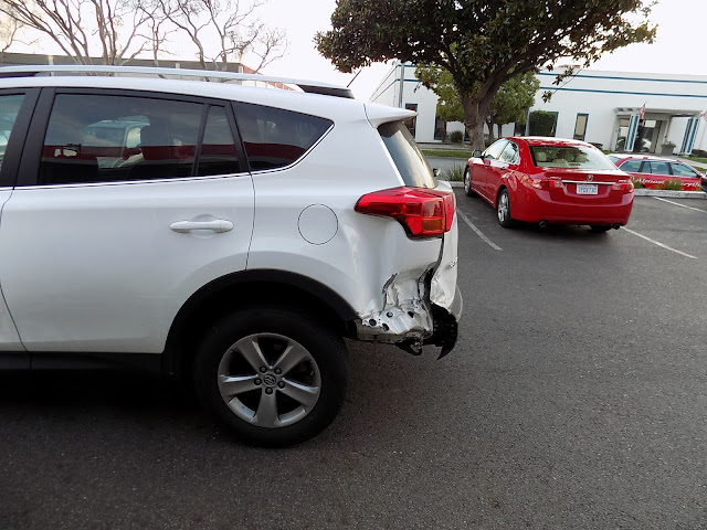Collision damage on 2015 Toyota RAV4 before repairs at Almost Everything Auto Body.
