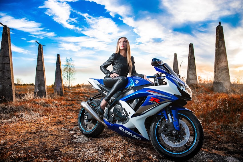 Woman In Black Leather Jacket Sitting On Blue And White Suzuki Gsx-r Woman In Black Leather Jacket Sitting On Blue And White Suzuki Gsx-r