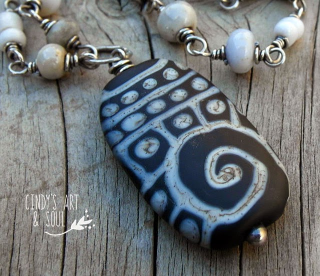 http://www.artandsouljewelry.com/products/gray-black-beaded-chain-necklace-lampwork