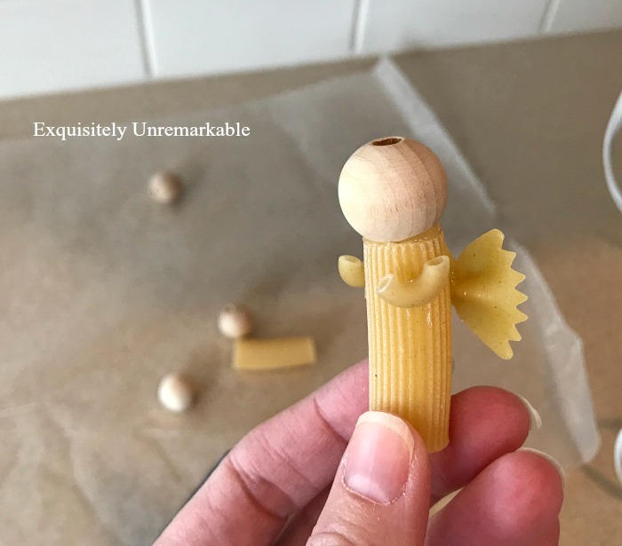DIY Pasta Angels with pasta wings, body and arms and a bead head