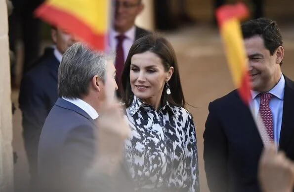 Queen Letizia wore a leopard-print silk blouse and midi skirt by Victoria Beckham. Carolina Herrera slingback black pumps