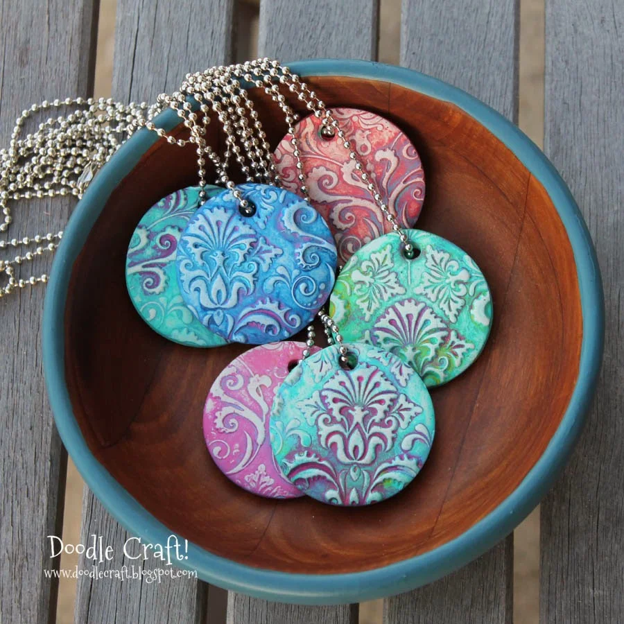 http://www.doodlecraftblog.com/2014/04/damask-polymer-clay-pendants.html