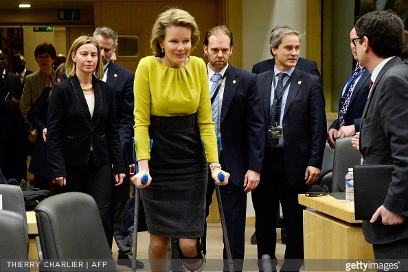 Queen Mathilde of Belgium walks with crutches as she arrives along with EU foreign policy chief Federica Mogherini to attend a conference on Ebola on March 3, 2015 in Brussels