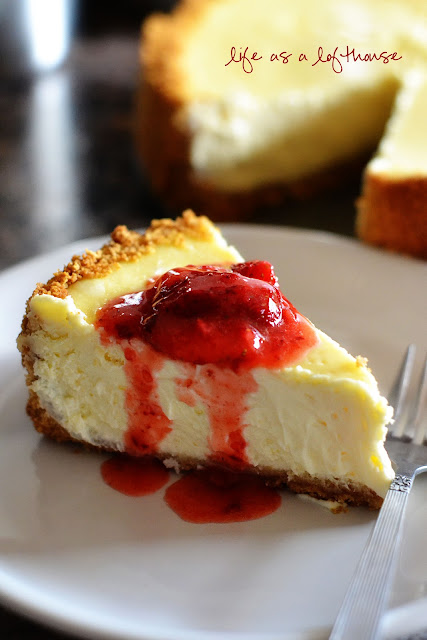 The Ultimate Cheesecake is a creamy, delicious homemade cheesecake topped with a simple strawberry topping. Life-in-the-Lofthouse.com