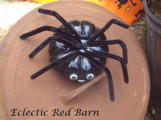 rusted cast iron lid with pumpkin spider