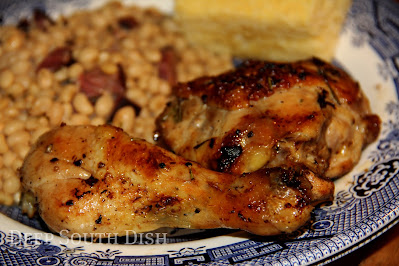 Chicken legs and thighs, basted with olive oil and lemon, and seasoned simply with a bit of Cajun seasoning, garlic powder, salt and pepper and fresh rosemary and first cooked under the broiler before a quick finishing bake in a hot oven.