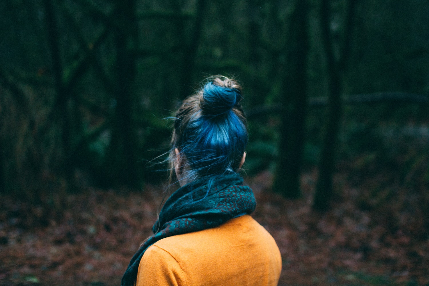 girl with blue hair in the woods