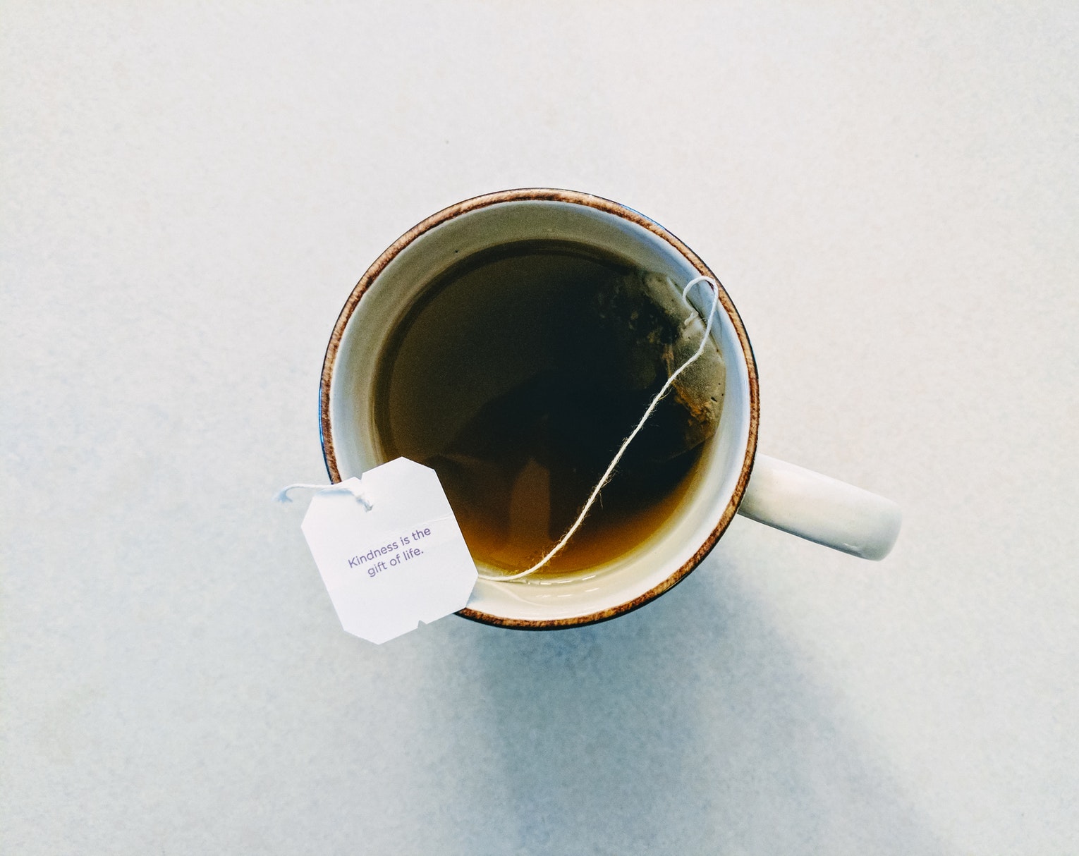 beautiful cup of freshly made tea with a tea bag and wish