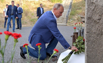Vladimir Putin laying flowers at the memorial stele of the 35th Coastal Battery memorial museum in Sevastopol.