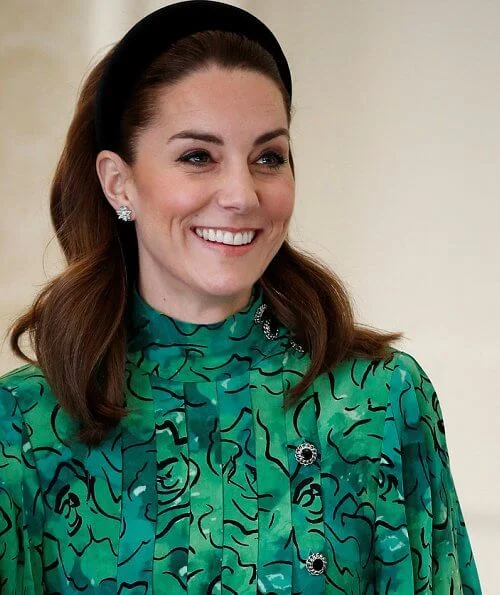 Kate Middleton wore a new silk peplum dress by Alessandra Rich, and Catherine Walker coat. Michael Higgins and Sabina Coyne